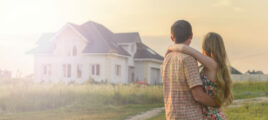 couple looking on house